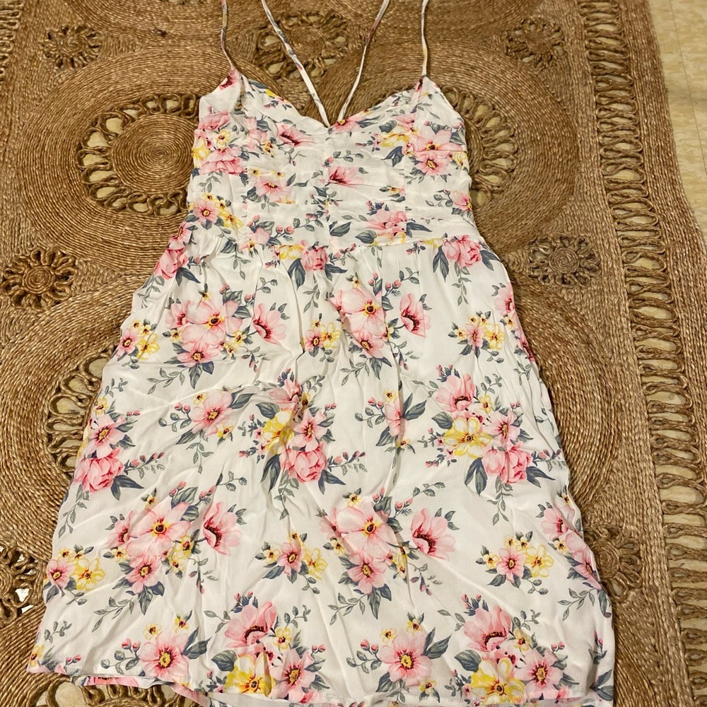 Floral printed dress; spaghetti straps with a lower back up string tie